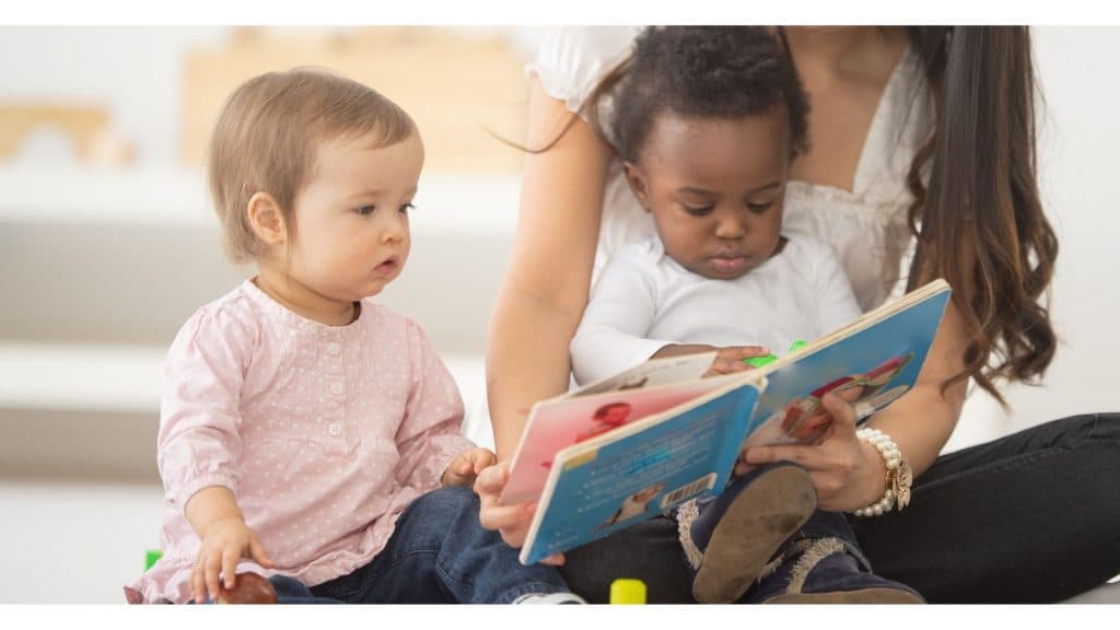 A parent walking their child into an early learning center